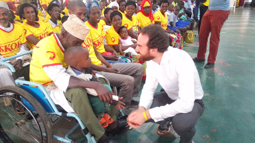 Thibault  Relecom ,the Chief Executive Officer of the Brussels based UNIBRA SA interacting with beneficiaries of Skol cares project.