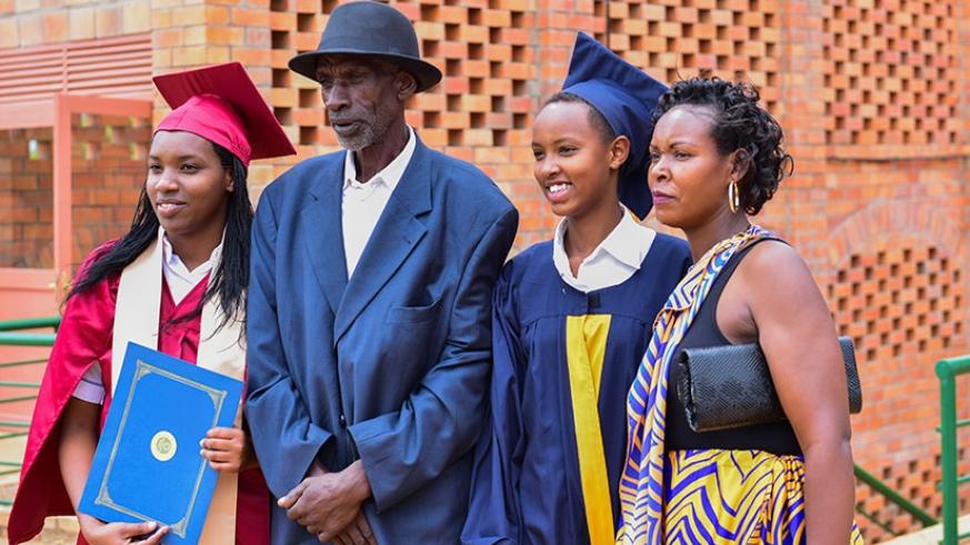 Karamaga and his wife at the graduation ceremony of their children.