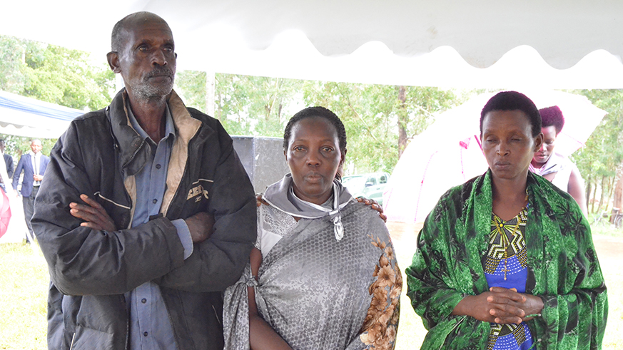 Florentine Benimana (centre) and her rescuers Rwagihanga (left) and his daughter Virginie Kamagennye alias Makwikwi. Photos/Kelly Rwamapera.