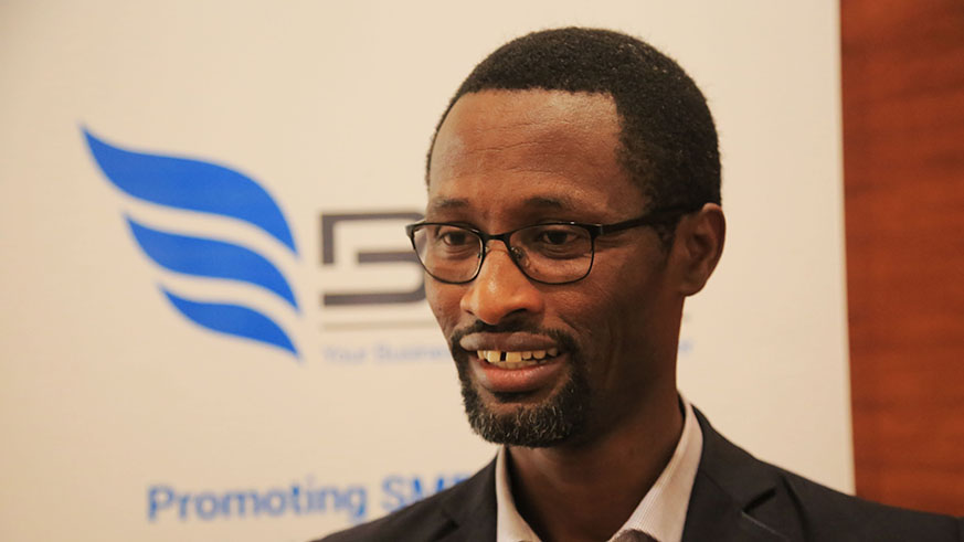 John Kagarama in charge of advisory services at BDF speaks to the media after the training in Kigali (Sam Ngendahimana)