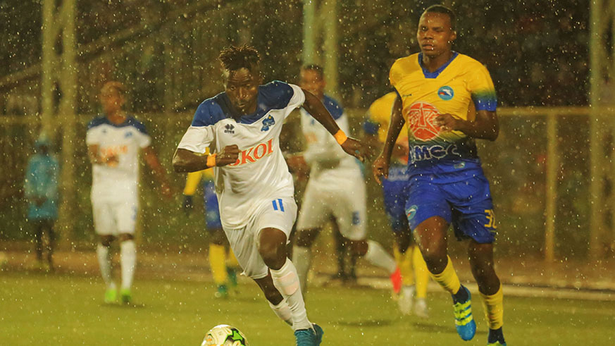 Rayon Sports striker Hussein u2018Tchabalalau2019 Shaban beats a Costa do Sol defender during the first leg at Kigali Stadium earlier this month. Sam Ngendahimana