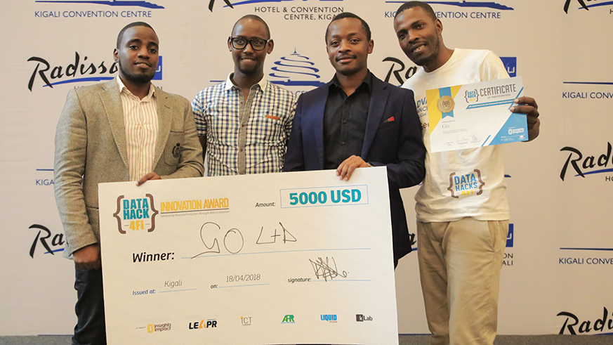 Winners of Data Hack 4FI Innovation Award hold a cheque of 5000 US $ in Kigali (Sam Ngendahimana)