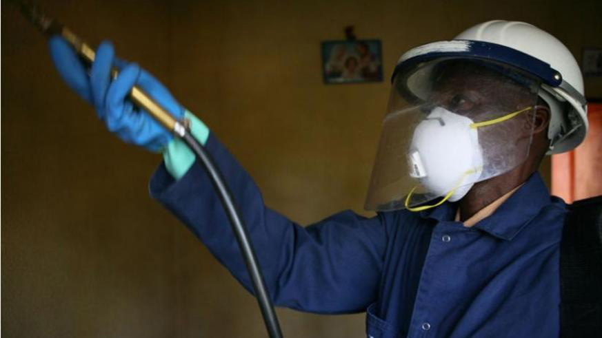 A man carries out indoor residual spraying in Bugeseera District. This is one of the ways to fight malaria in Rwanda. File.