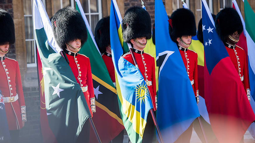 Soldiers of the Coldstream Guards with flags of the 53 Commonwealth member states in London yesterday.  Village Urugwiro.
