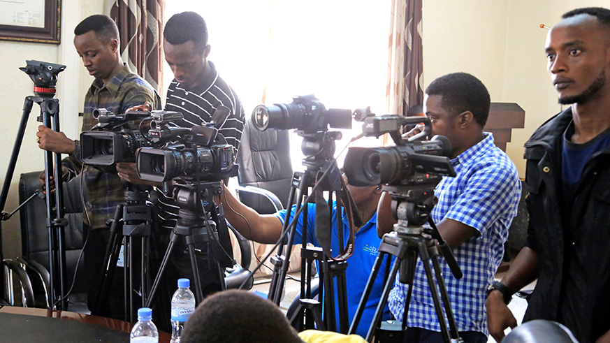 journalists try their tools as they record the conference. Photos by Julius Bizimungu