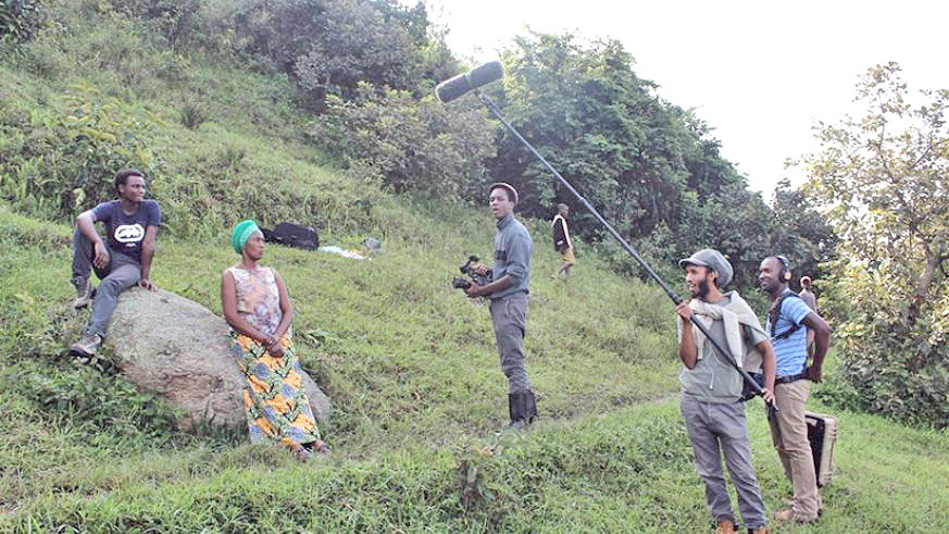 Aspiring local filmmaker Samuel Inshimwe (C) on set of his film â€˜Imfuraâ€™ that  talks about the post-genocide Rwanda. Courtesy.