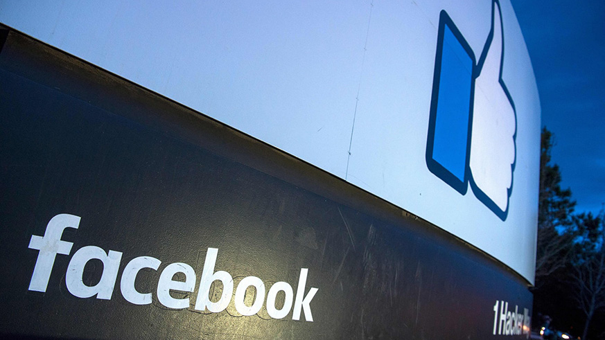 A lit sign at the entrance to Facebooku2019s corporate headquarters. Net photo.