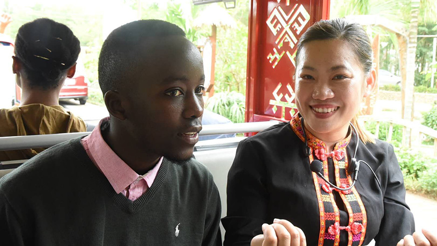 The author speaks to a Li tour guide during his visit to their village. Courtesy.