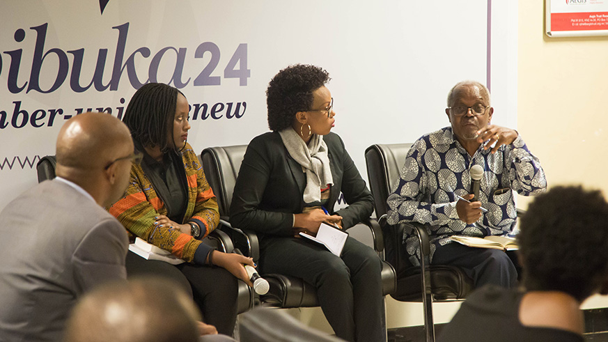 Senator Antoine Mugesera (R)  speaks during a panel discussion of the 100 Days, 100 Questions that was organised to furnish Rwandan youth with answers to some of their lingering questions about the events of 1994 Genocide against the Tutsi. In the middle is Franu00e7oise Murekatete, a psychologist with AVEGA-Agahozo while on the left is Kevine Ines Umwali, who was one of the moderators. Nadege Imbabazi.