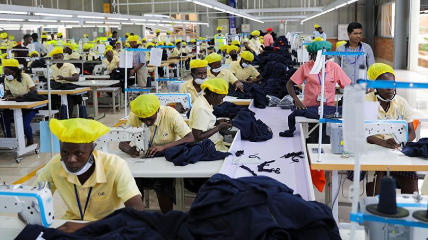 Workers at C&H garment factory at the Kigali Economic Zone make outfits. File.