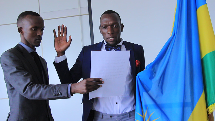Kagere swears in at the naturalisation ceremony held at Kigali City Hall. 