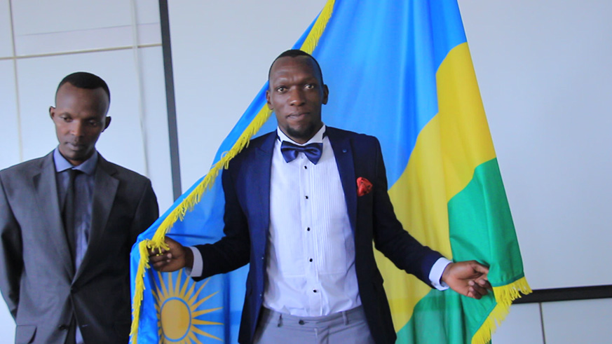 Kagere embraces the Rwandan at the naturalisation ceremony. 