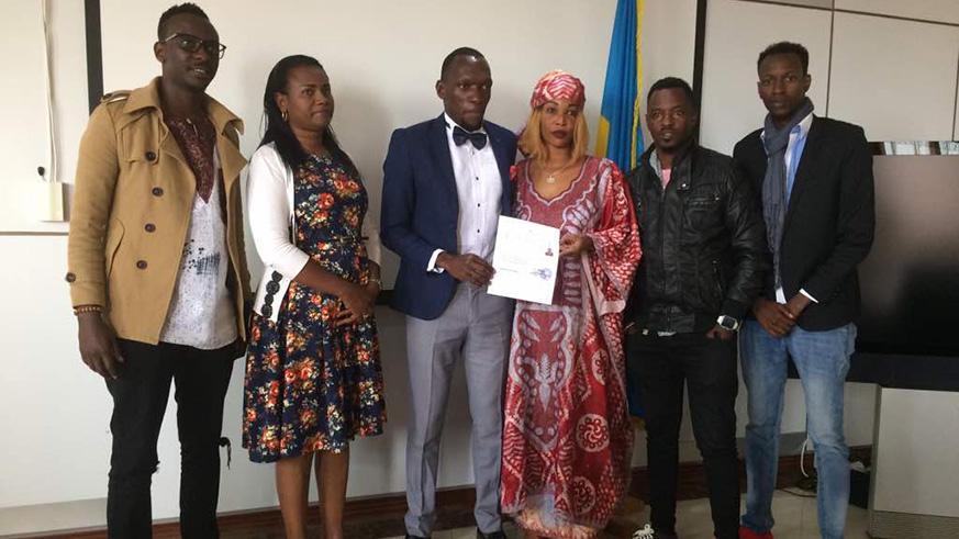 Kagere poses with his friends and family members after completing his naturalisation process. (Courtesy photos)