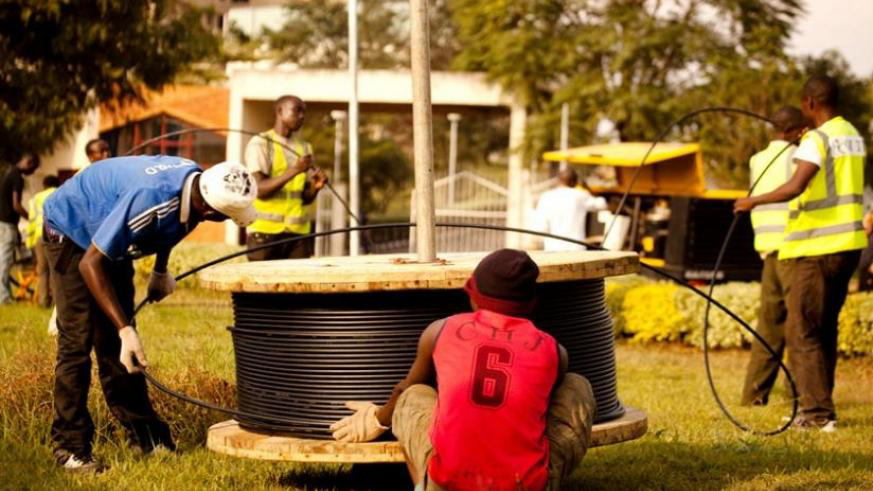 Telecom workers install fibre optic cables in Kigali. Liquid Telecom, a regional data, voice and IP service provider, has a mission of spreading reliable internet access to homes across Kigali. File.