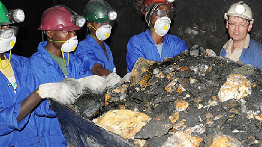 Miners leaving a tunnel in Rulindo District