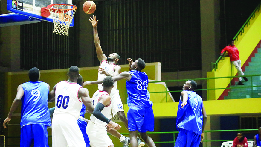 REGu2019s Olivier Shyaka drives to the basket during a past match against Espoir at Petit Stade in Remera. File.
