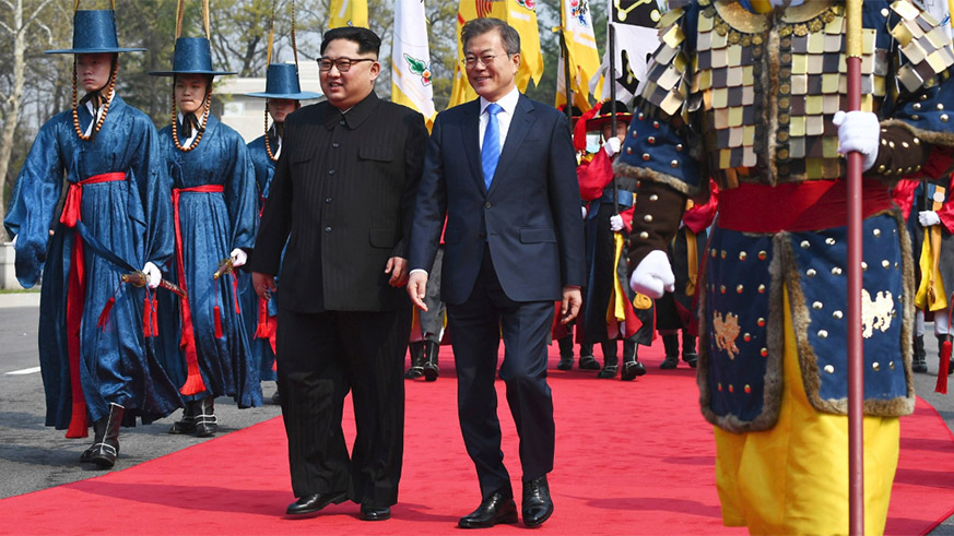 The North Korean leader, Kim Jong-un, with President Moon Jae-in of South Korea today. They were trailed by an honor guard in 19th-century uniform. Internet photo