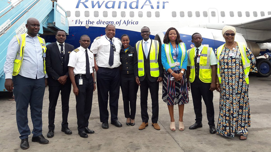 Rwandaâ€™s envoy to Nigeria Stanislas Kamanzi (4th right) with crew and other officials at Nnamdi Azikwe International Airport upon landing of RwandAirâ€™s maiden flight to Abuja yesterday. Courtesy.