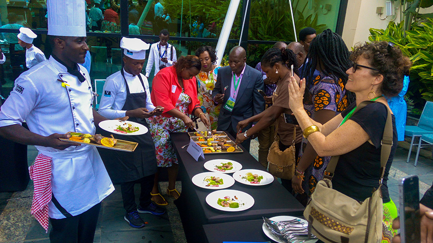 Chef Bosco Manishimwe from Rwanda displays his dishes, as people taste a variety of meals during the culinary competition at Kigali Marriott Hotel, on April 28. Photos by Faustin Niyigena.