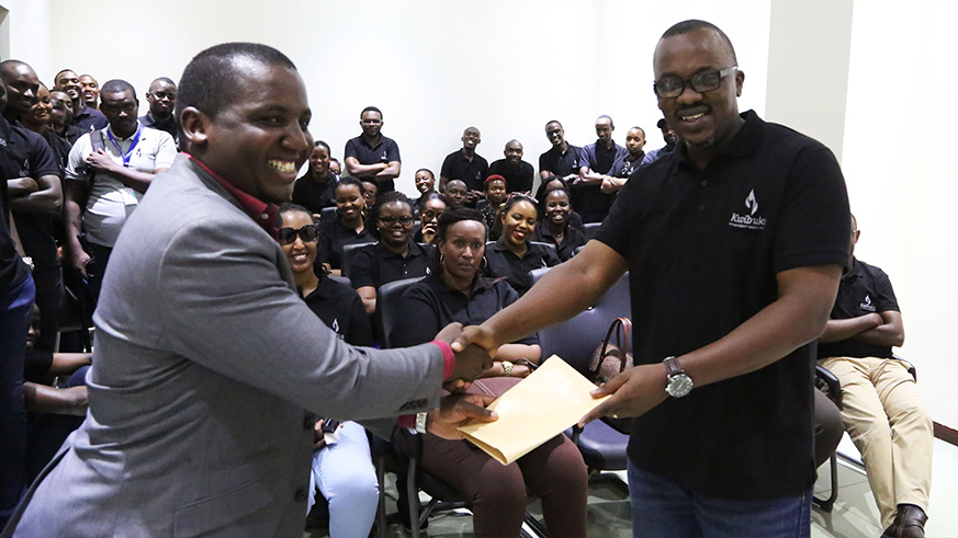 BDF Cheif Executive Officer hands a cheque to the museum's officer.