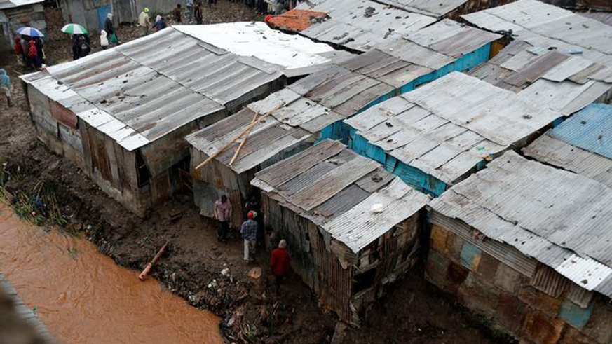 A general view shows the Nairobi river flowing through the Huruma neighbourhood after a six-storey building collapse after days of heavy rain in Nairobi in 2016. Net photo.