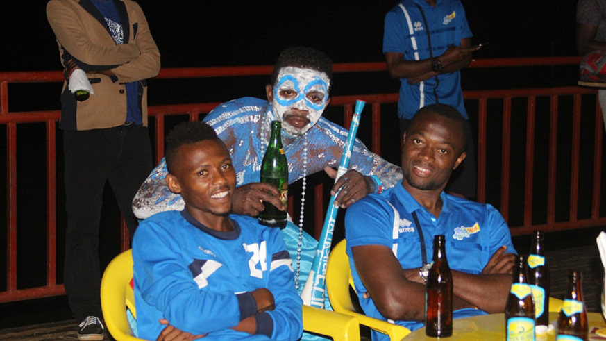 Players posing with fan. Peter Kamasa