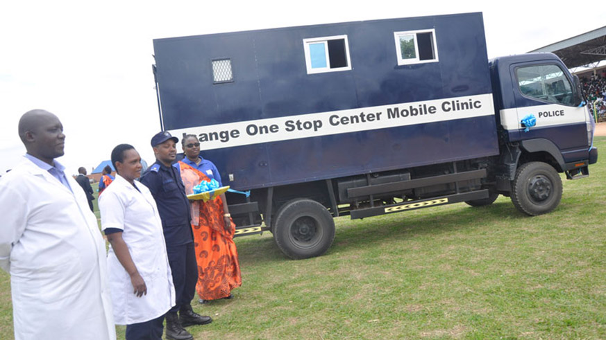 A Police officer sensitises Musanze residents about gender based violence. The Isange Mobile Clinic is one of the initiatives government has put in place to help in the fight against gender based violence . File.