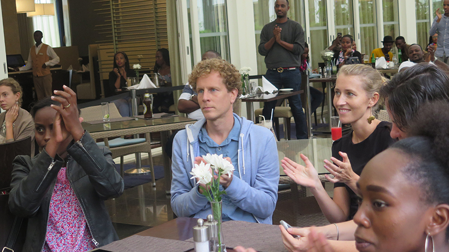 Concertgoers applause Sammie Soul's incredible saxophone  skills during his performance-Eddie Nsabimana