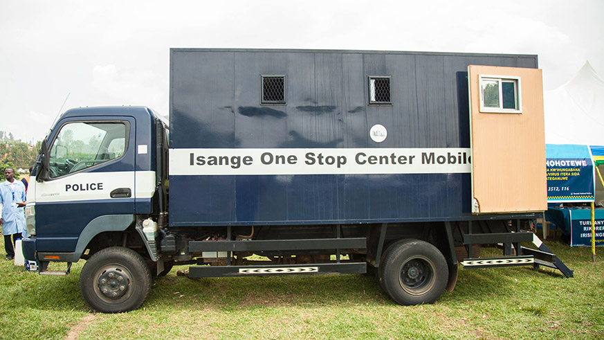 A Police officer sensitises Musanze residents about gender based violence. The Isange Mobile Clinic is one of the initiatives government has put in place to help in the fight against gender based violence . File.
