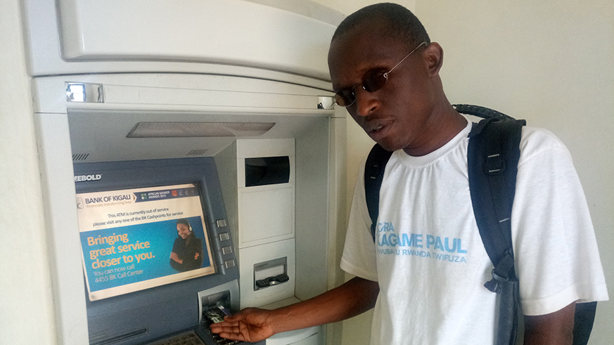 Pierre Nyankiko explains to The New Times about the difficulties he faces while using an ATM. Emmanuel Ntirenganya.
