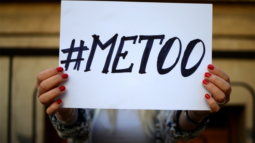 A woman displays a placard in show of support for the #MeToo campaign. Net.