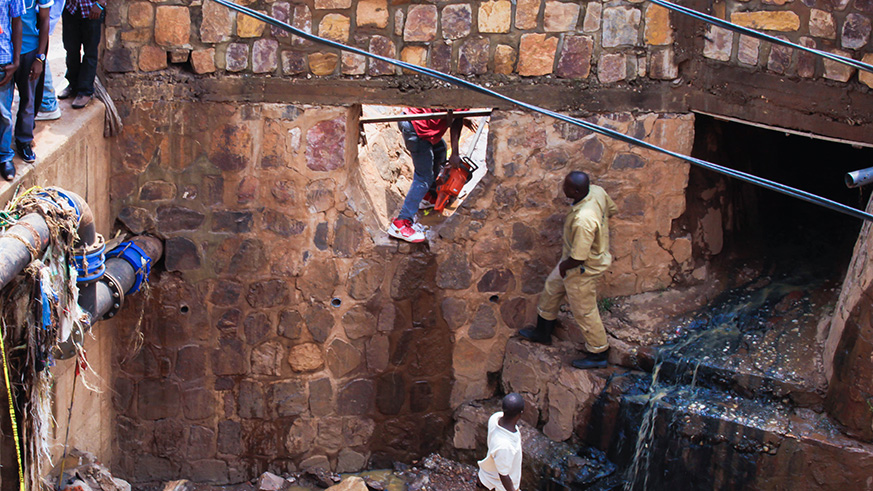 People cleaning a drainage in Nyabugogo area. Government has secured u20ac96 million for the first ever Kigali Sanitation and Central Sewerage System. File.