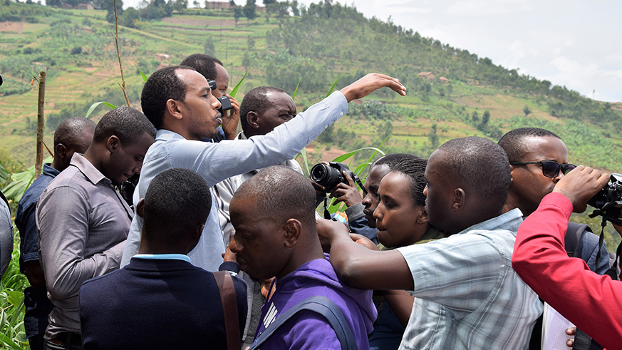 Head of Water Resources Management, Tetero Francois as he explains to Journalists about the Upper Nyabarongo Catchment rehabilitation plan.