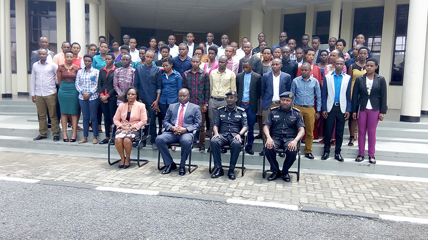 Officials and trainees pose for a group photo after the closure of the four-month course at National Police College in Musanze. Jean du2019Amour Mbonyinshuti.
