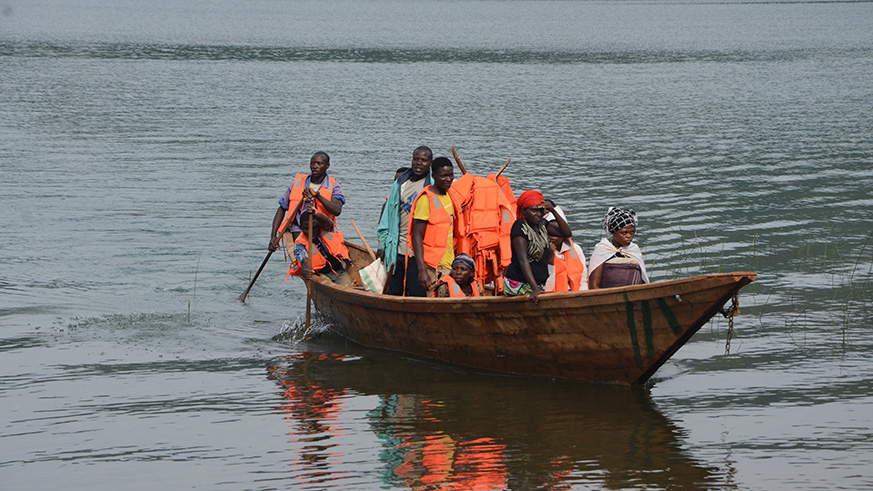 Residents of Nkombo island use local boats to travel on Lake Kivu. The Island will soon have a port. Sam Ngendahimana.