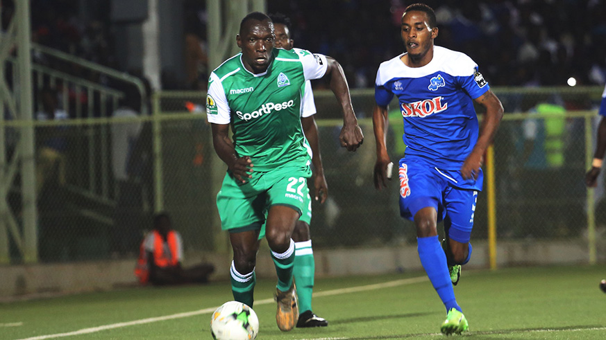 Gor Mahiau2019s Rwandan striker Meddie Kagere (left) and Rayon Sportsu2019 left-back Eric Rutanga (right) were on target as both sides played out a 1-all draw in their first CAF Confederation Cup group encounter at Kigali Stadium yesterday.  Sam Ngendahimana.
