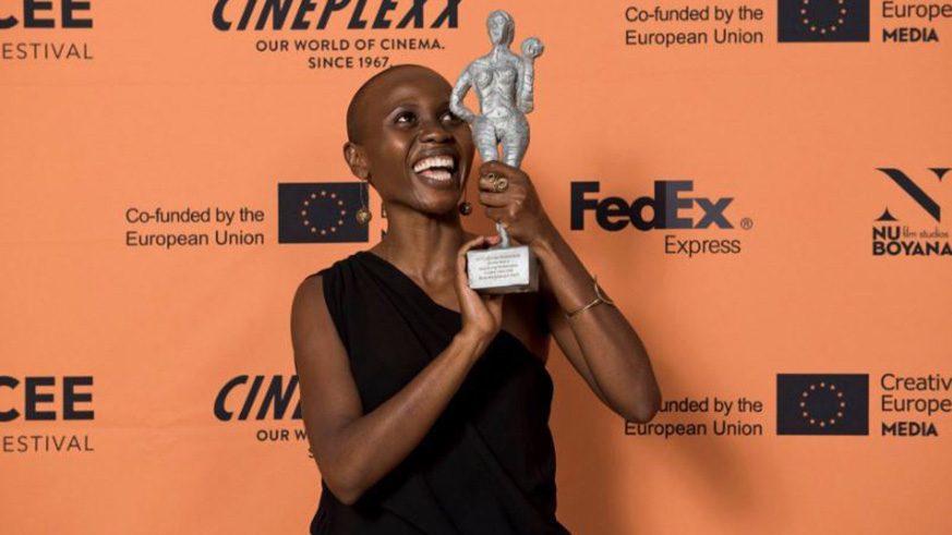 Umuhire shows off her Letu2019s CEE Award for the Best Acting Performance in the u2018Birds Are Singing in Kigaliu2019 last month, in Vienna. Over the weekend, the same movie won her another major award in Poland. Net. 