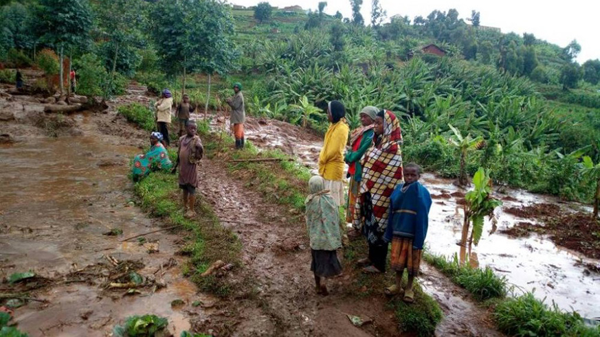 Residents in Karongi District observe the aftermath of the weekend heavy downpour. Courtesy.