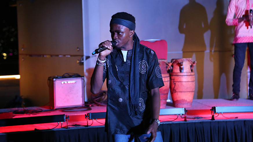 A student sings on stage as part of the festival performances