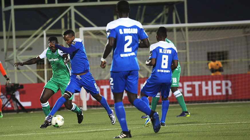 Midfielder Yannick Mukunzi tries to protect the ball during the match