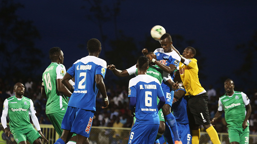 Skipper , goalkeeper Jean Luc Ndayishimiye battles for the ball with players during 1-1 draw at Kigali Stadium (Sam Ngendahimana)