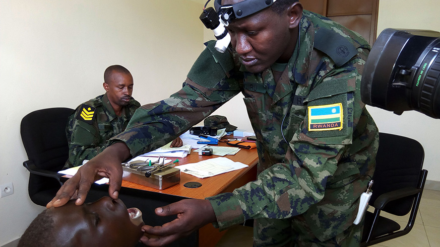 One of RDF medical doctors attending to one of the patients at Nyamata hospital on Friday, Jean d'Amour Mbonyinshuti