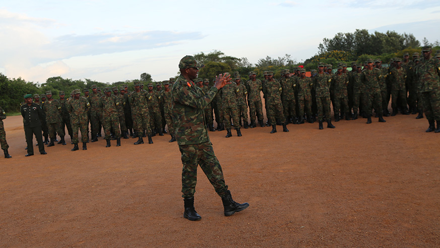 RDF Army Chief of Staff Lt General Jacques Musemakweli briefs the troops before their departure. Courtesy