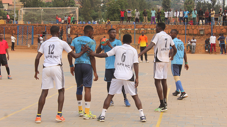 Police (in light blue) overcame arch-rivals APR (in black and white) in a tightly fought victory on Sunday afternoon at Kimisagara Youth Center courts. (Damas Sikubwabo)