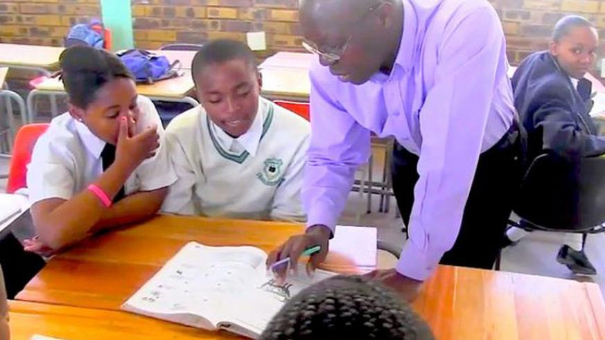 A teacher instructing pupils. FIle.