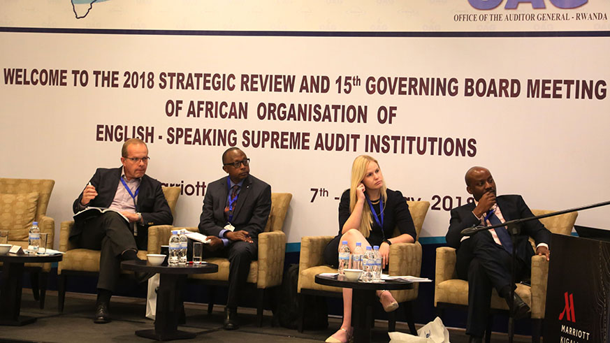 Auditor General Obadia Biraro (2nd left) with other panelists, follow a presentation during the meeting in Kigali yesterday.  Photos by Sam Ngendahimana.