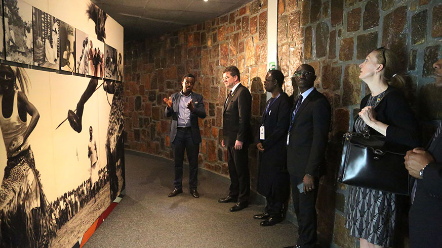 Miroslav LajÄÃ¡k and his delegation follow the guide as they tour  in Kigali Genocide Memorial on Tuesday (Sam Ngendahimana)