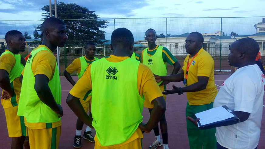 Head Coach Anaclet Bagirishya giving instructions to players in a training session on Thursday afternoon at Amahoro stadium. (Damas Sikubwabo)