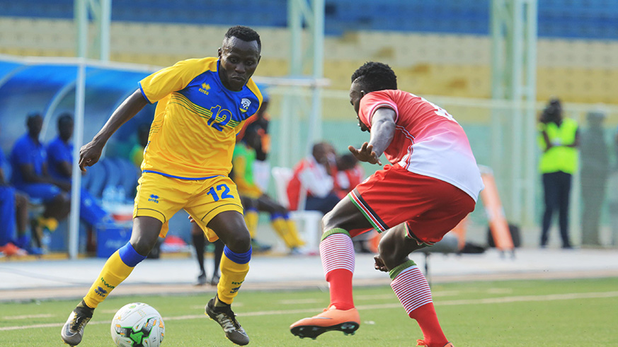 Amavubi U-20u2019s Marc Govin Nshimiyimana tries to go past Kenyan defender Vincent Wanyambo a fortnight ago in Kigali.  Sam Ngendahimana.