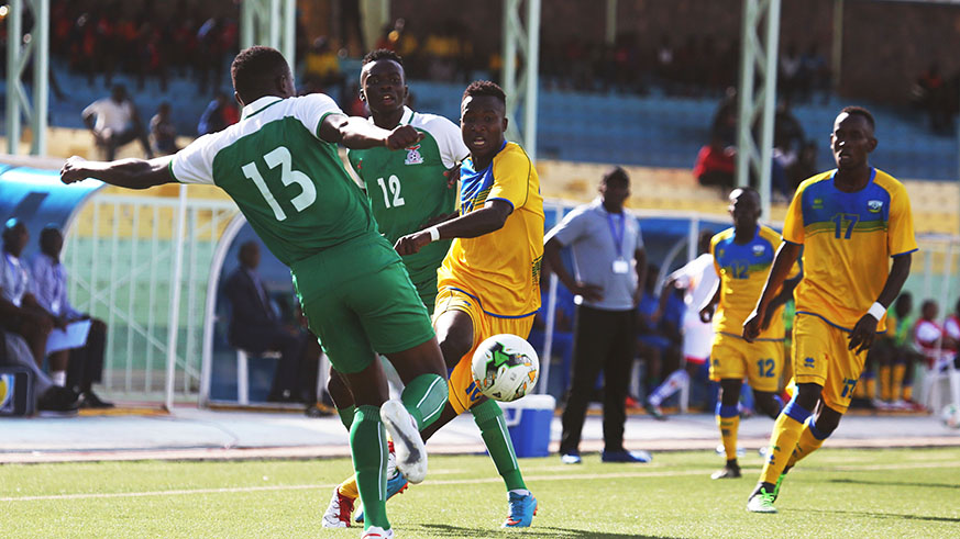 U20 Amavubi forward Lague Byiringiro beats for the ball Zambian left-back Christopher Katongo during a 2-0 defeat match at Kigali Stadium. Sam Ngendahimana.